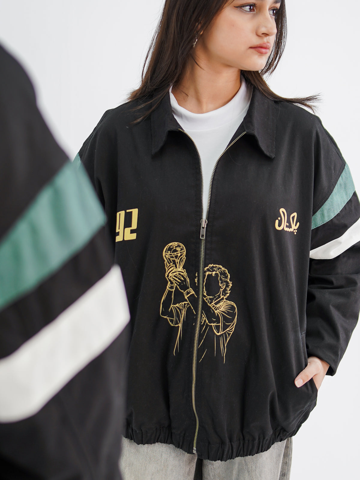 Cornered Tigers '92 jacket styled with wide-leg jeans — Rakh Pakistani streetwear